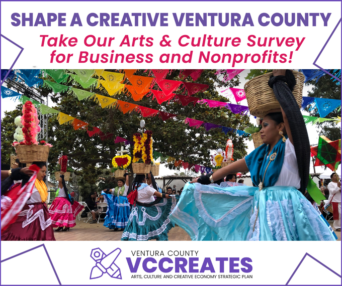 An image of traditional Mexican folklorico dancers at an event with papel picado